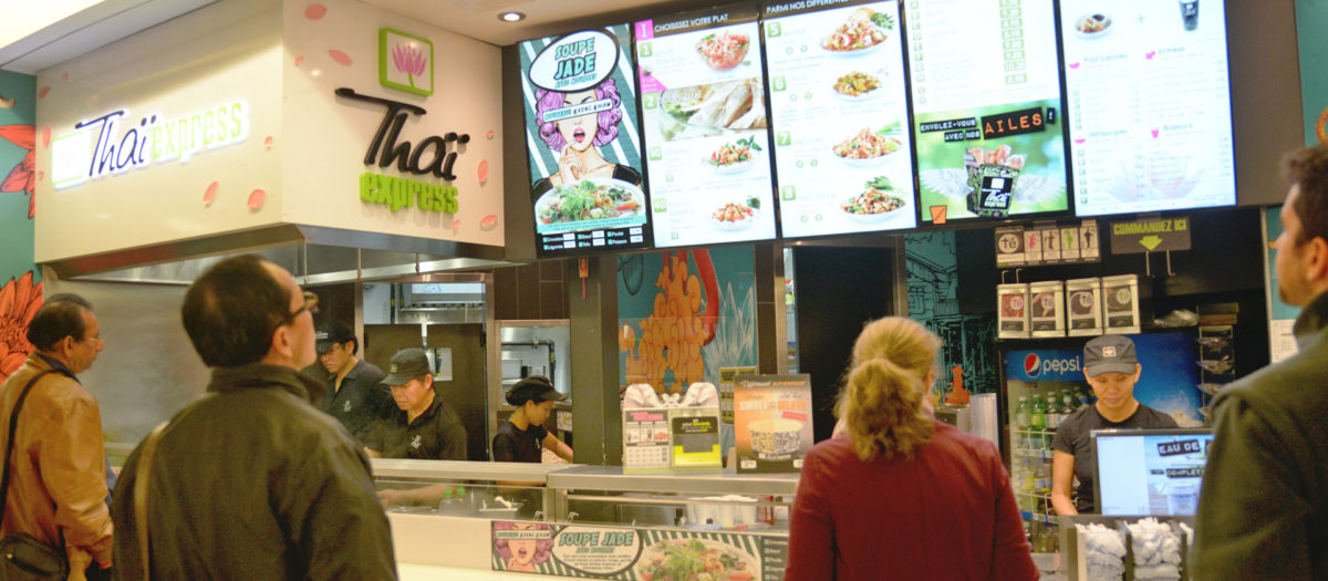 Thai Express Franchise Mall Location With a Line of Customers